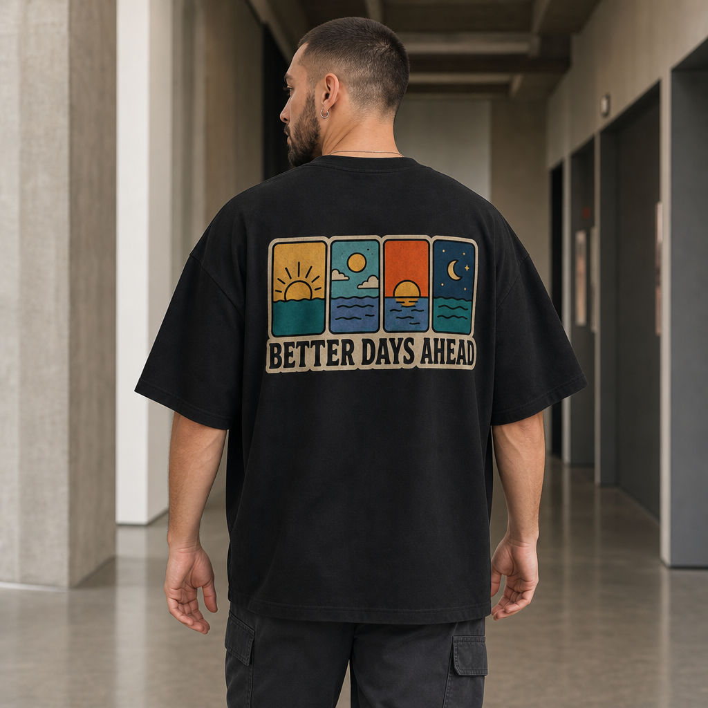 Better Days Ahead Oversized Tee in Black – back view worn by an adult man