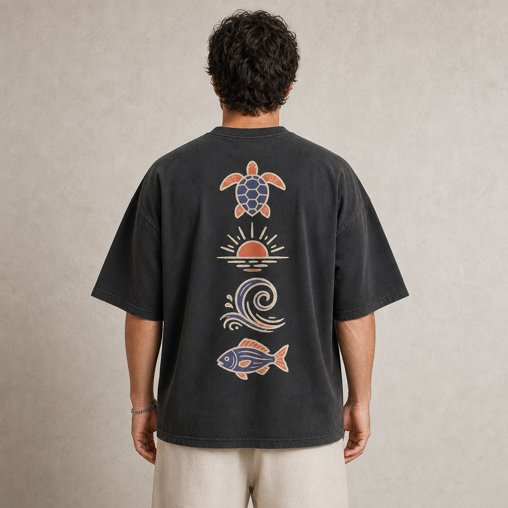 Coastline Icons Tee in Faded Black – back view worn by an adult man