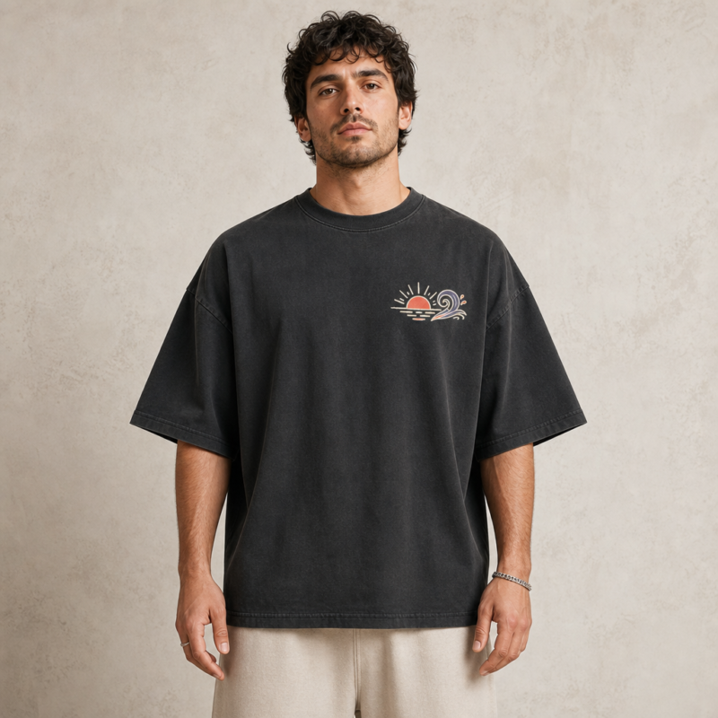 Coastline Icons Tee in Faded Black – front view worn by an adult man
