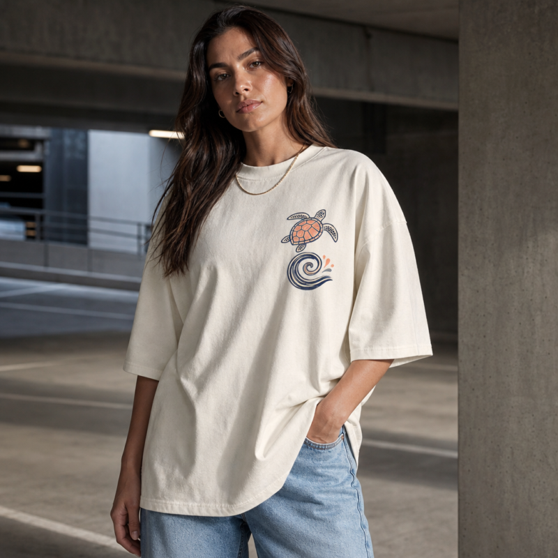 Ocean Signals Oversized Tee in White – front view worn by an adult woman