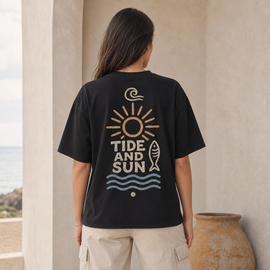 Tide And Sun Boxy Tee in Black – back view worn by an adult woman