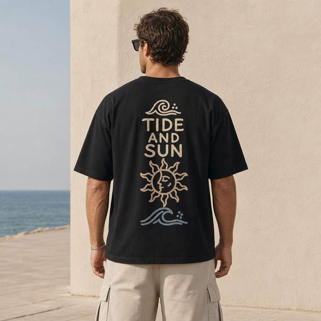 Tide And Sun Boxy Tee in Black – back view worn by an adult man