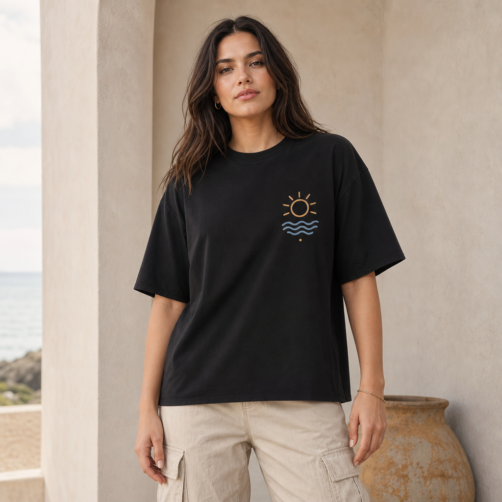 Tide And Sun Boxy Tee in Black – front view worn by an adult woman