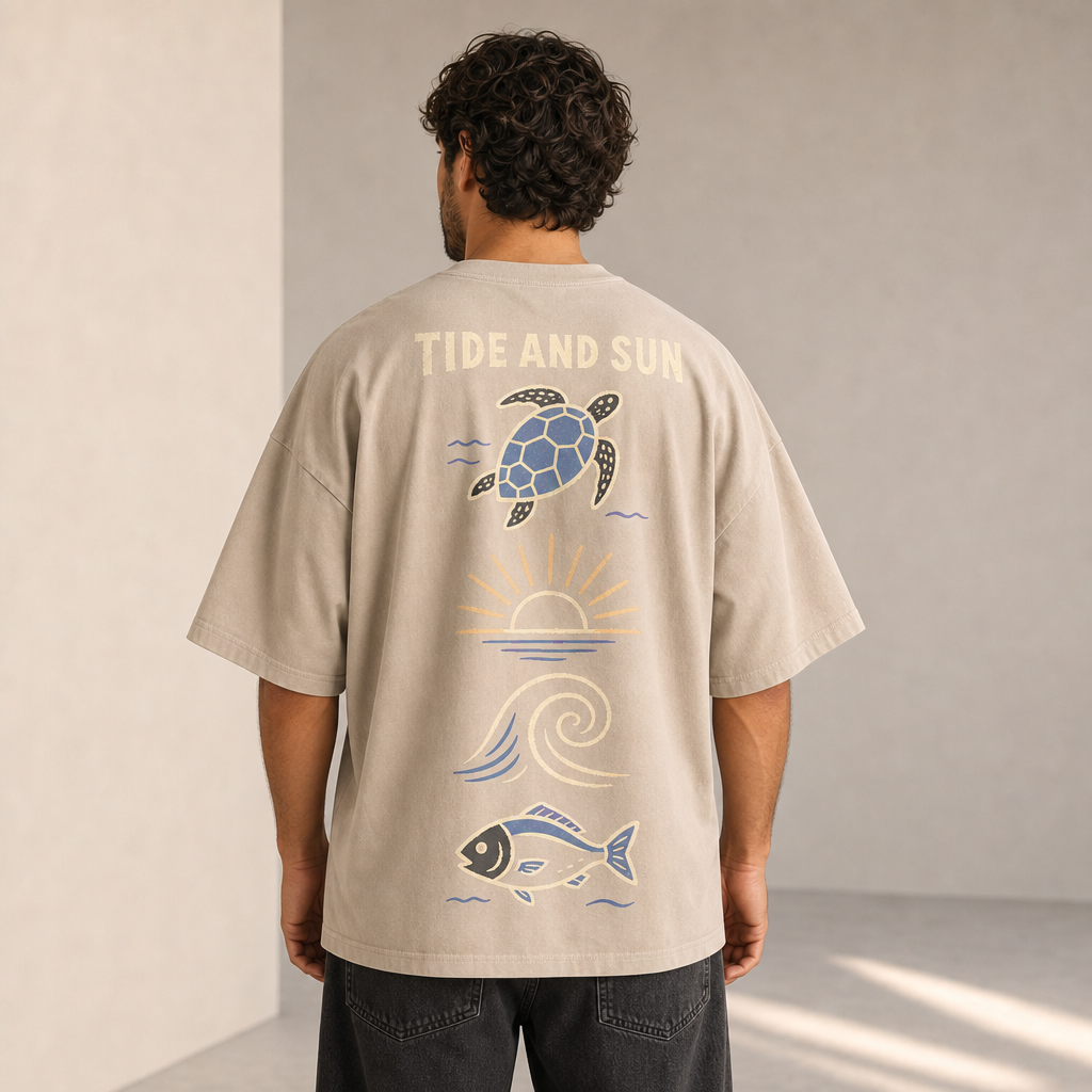 Tide And Sun Oversized Tee in Stone – back view worn by an adult man