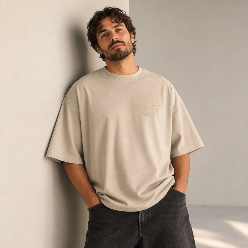 Tide And Sun Oversized Tee in Stone – front view worn by an adult man