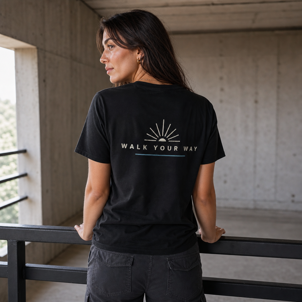 Walk Your Way Women's Tee in Black – back view worn by an adult woman