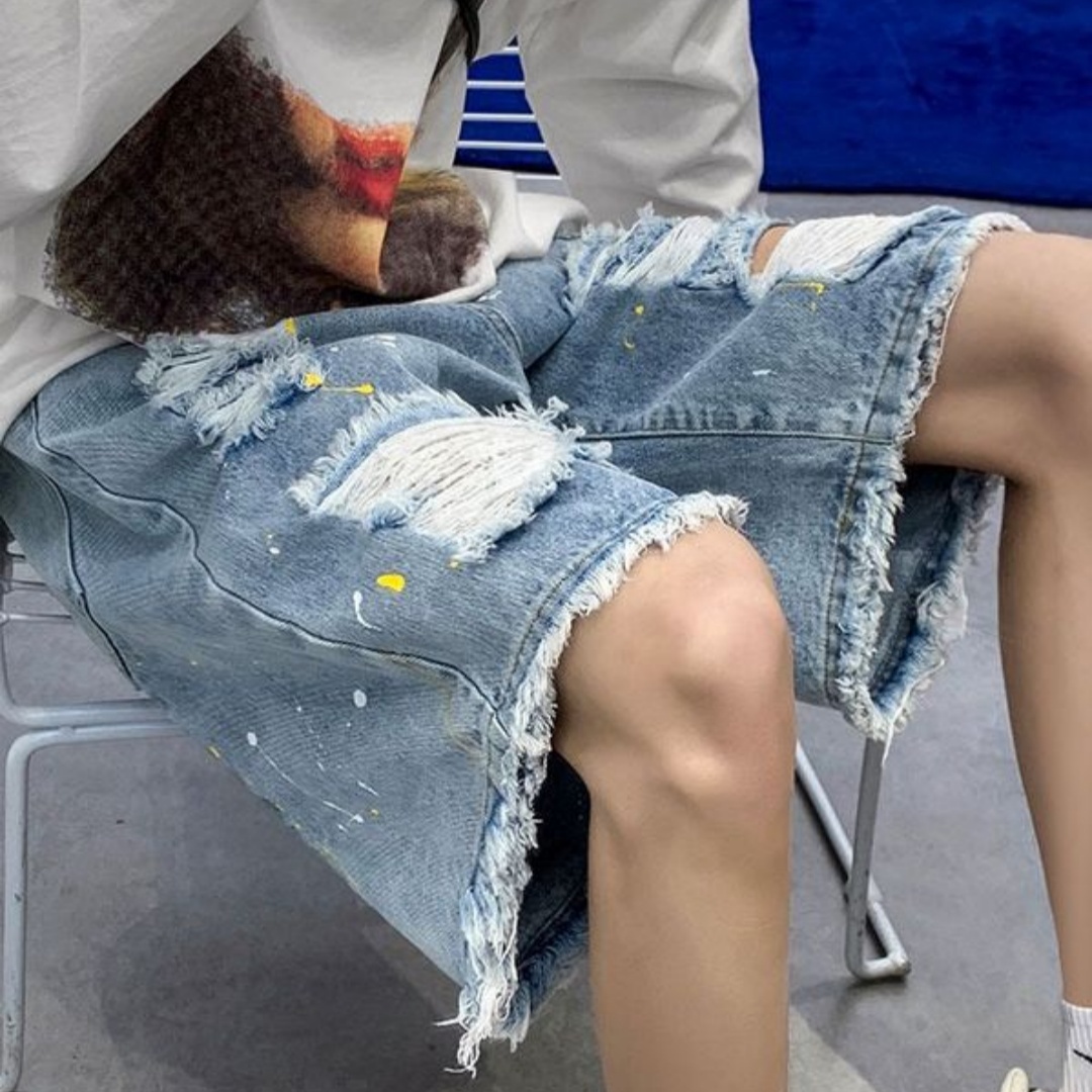 Men’s Distressed Denim Shorts with Frayed Hems and Paint Flecks