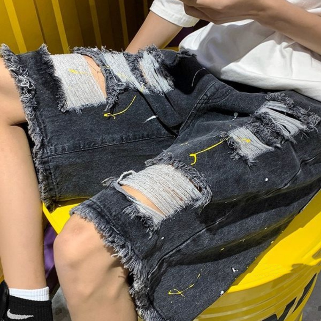 Men’s Distressed Denim Shorts with Frayed Hems and Paint Flecks