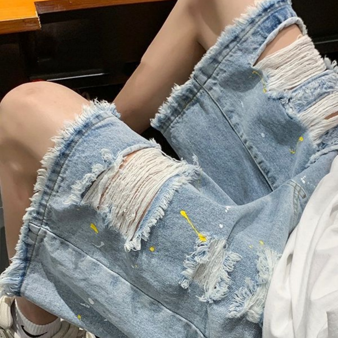 Men’s Distressed Denim Shorts with Frayed Hems and Paint Flecks