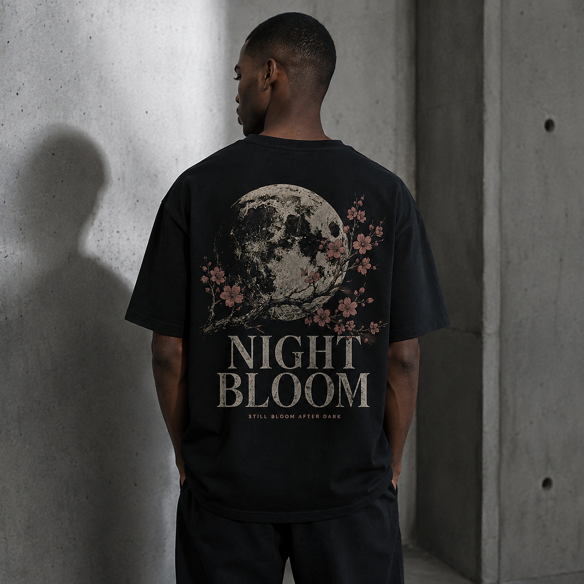 Model wearing the Night Bloom Tee in Black from the back