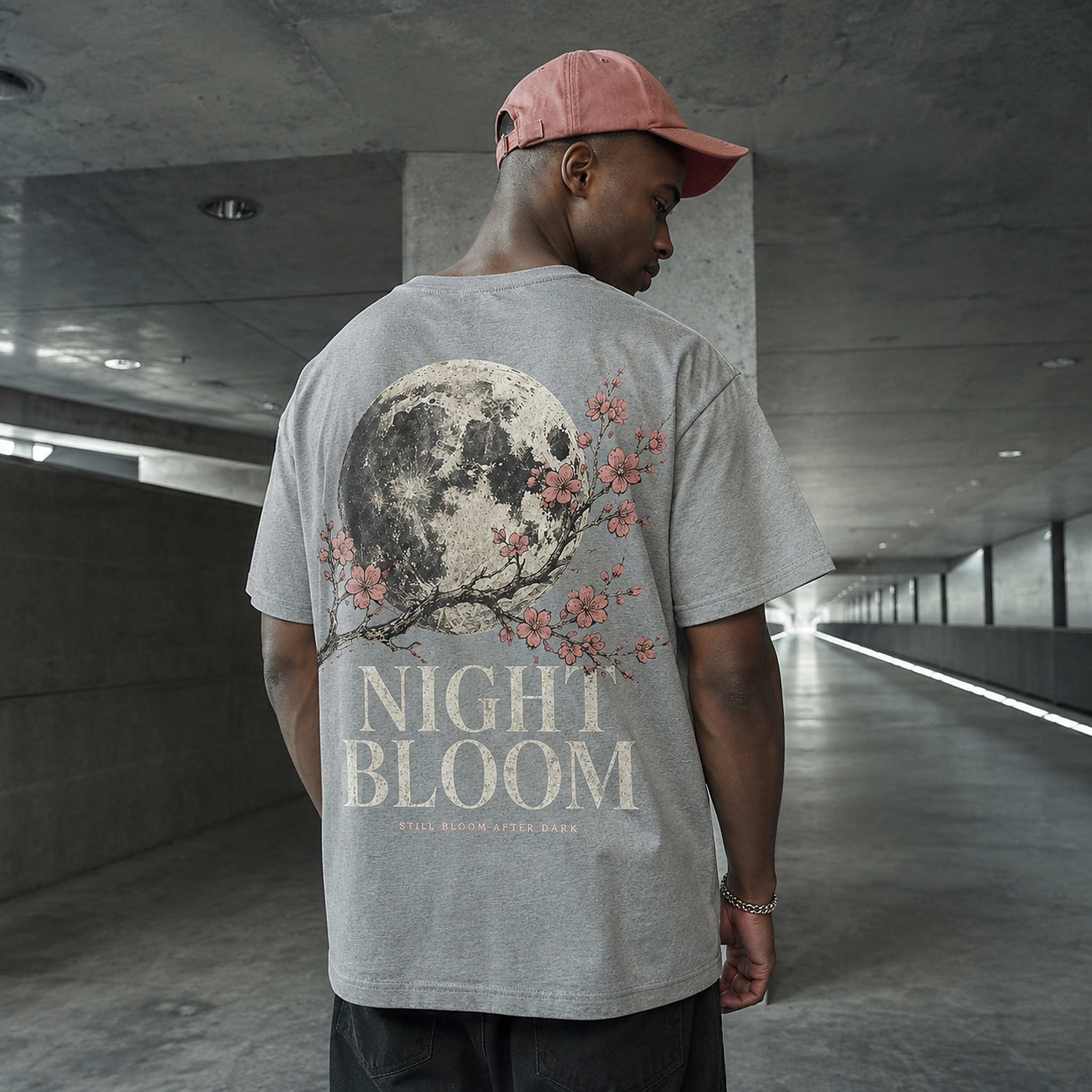 Model wearing the Night Bloom Tee in Light Asphalt from the back
