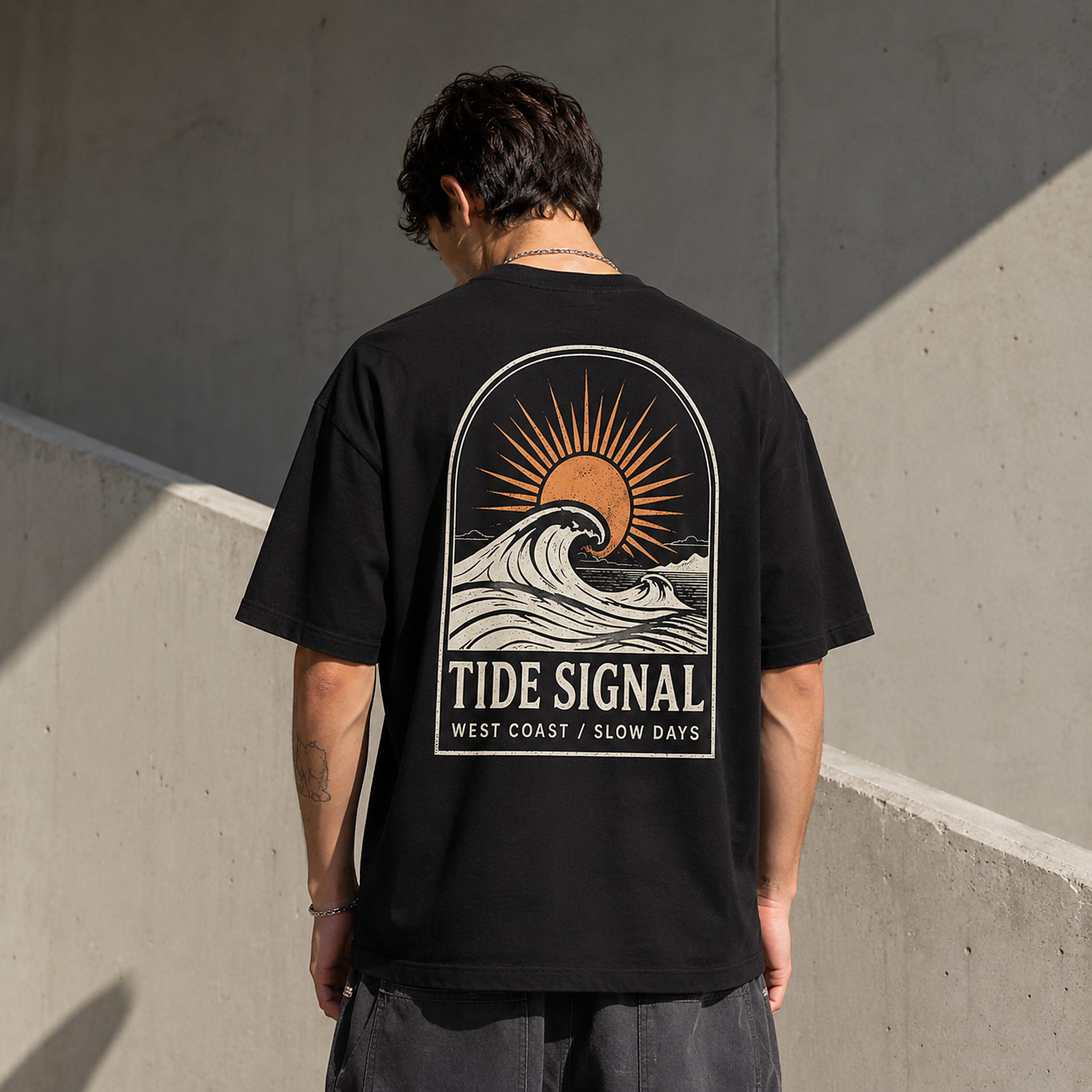 Model wearing the Tide Signal Tee in Black from the back
